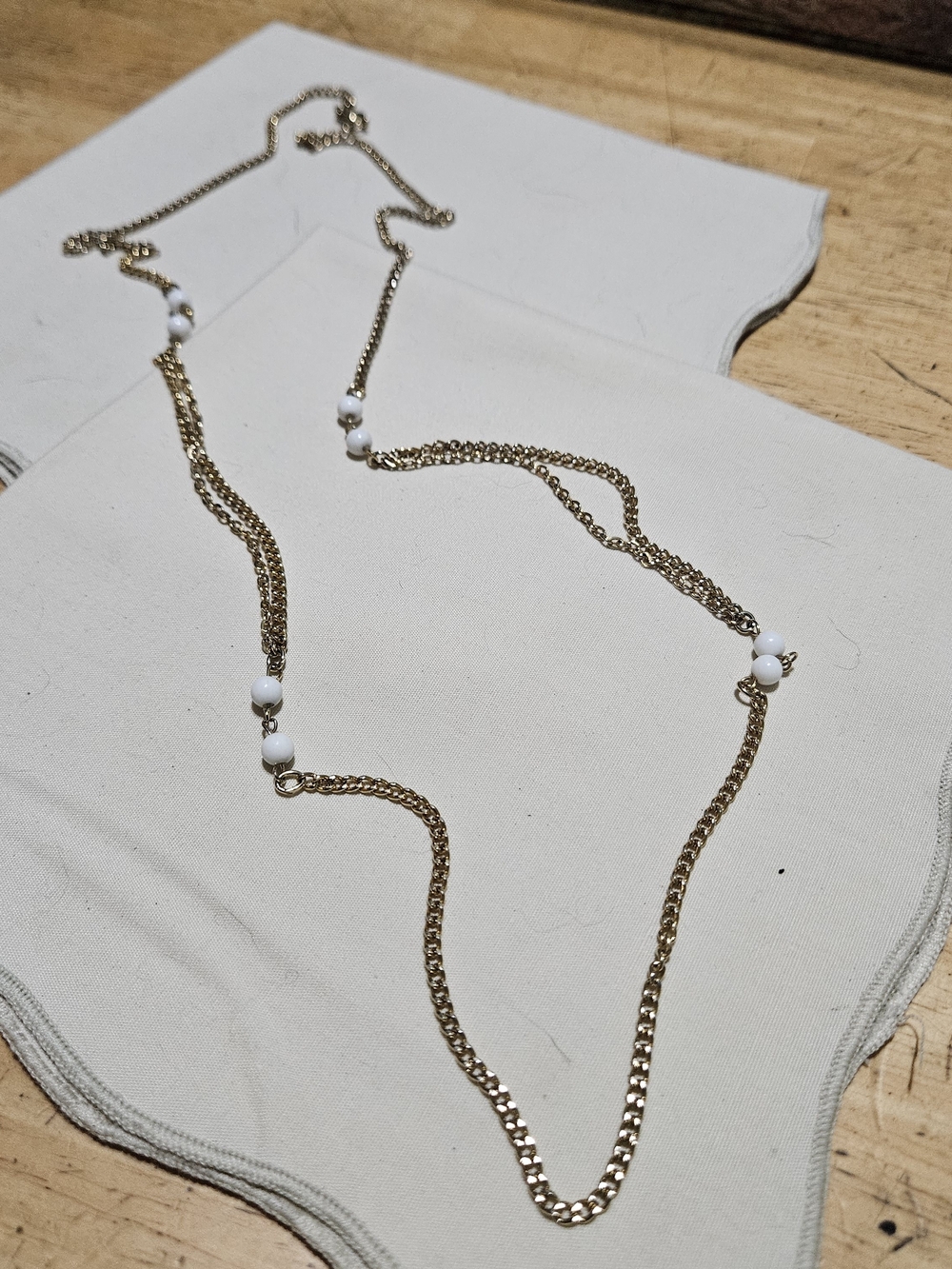 Gold-toned Layered Chain Necklace with White Bead Accents